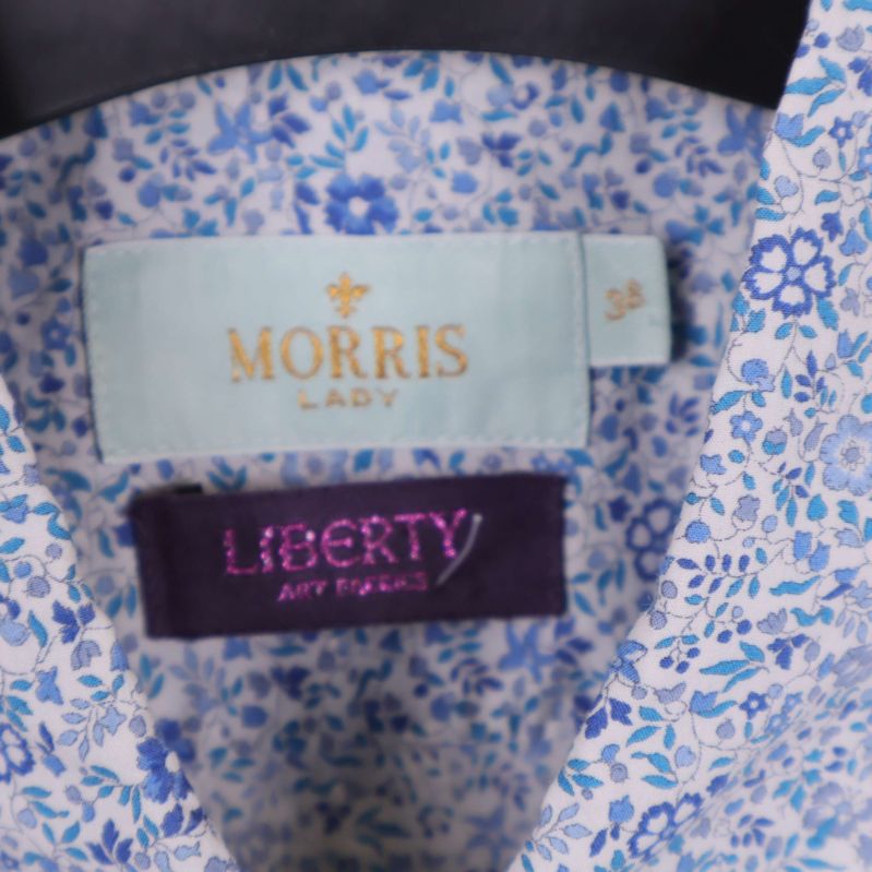 Närbild på etikett med texten Morris Lady och Liberty Art Fabrics