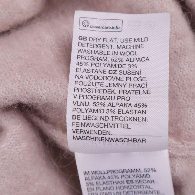 Materiallapp med sammansättning på flera språk