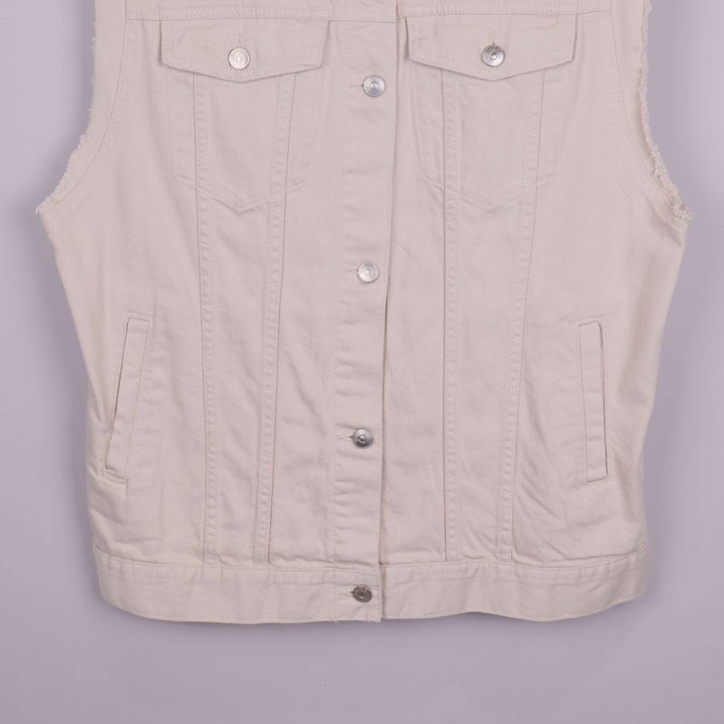 Nederdel av beige jeansväst med kanter och fickor