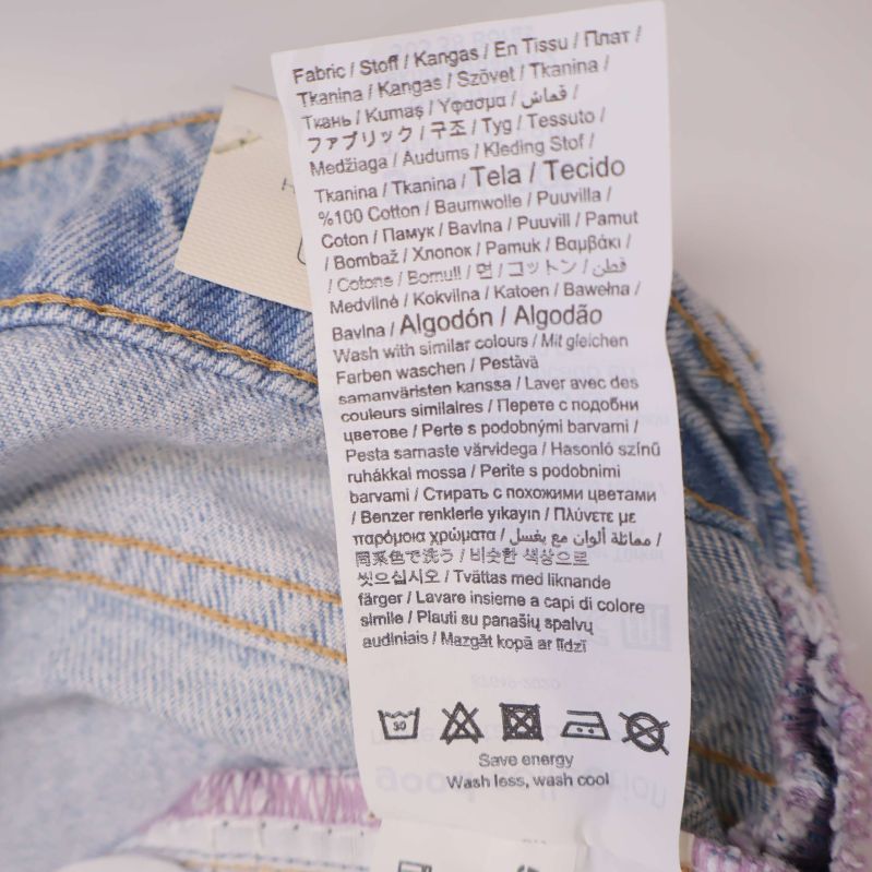 Materiallapp med information om 99% bomull och 1% elastan
