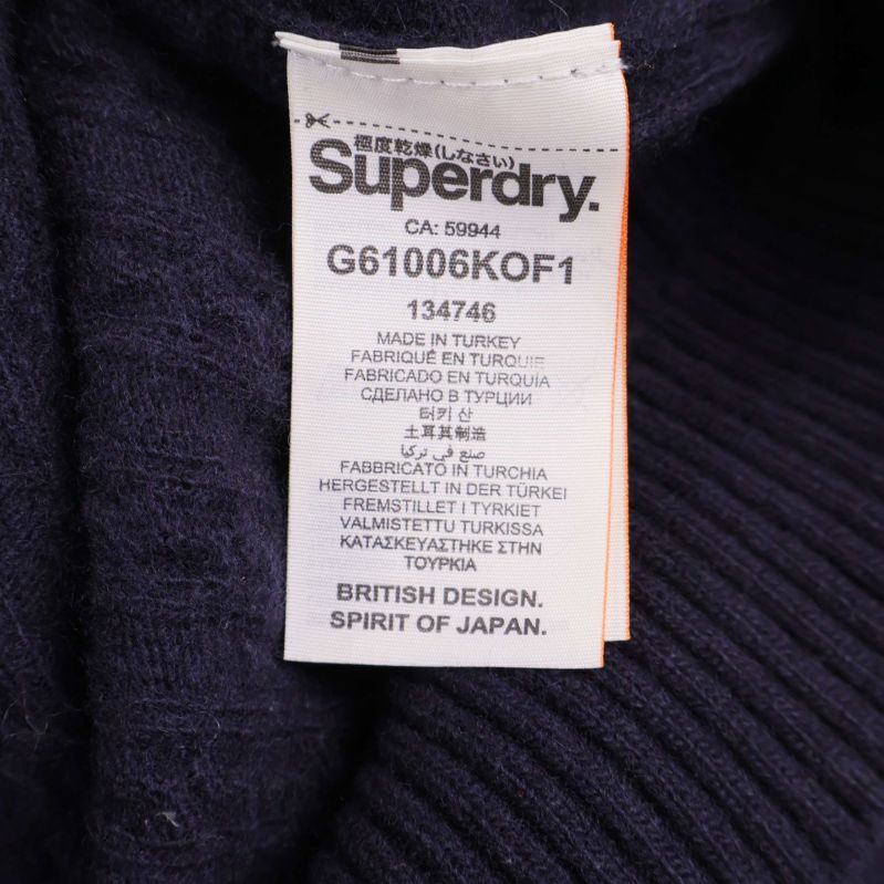 Material- och produktetikett från Superdry med tillverkningsinfo