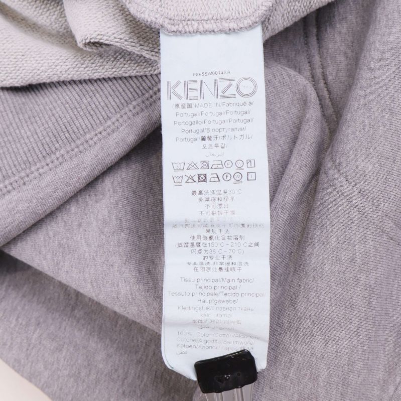 Material- och skötselrådsetikett från Kenzo insida av sweatshirt