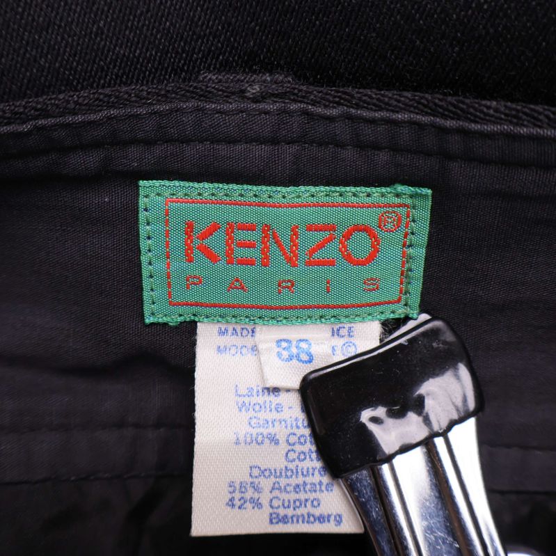 Kenzo Paris-logotyp och materialetikett på byxans insida