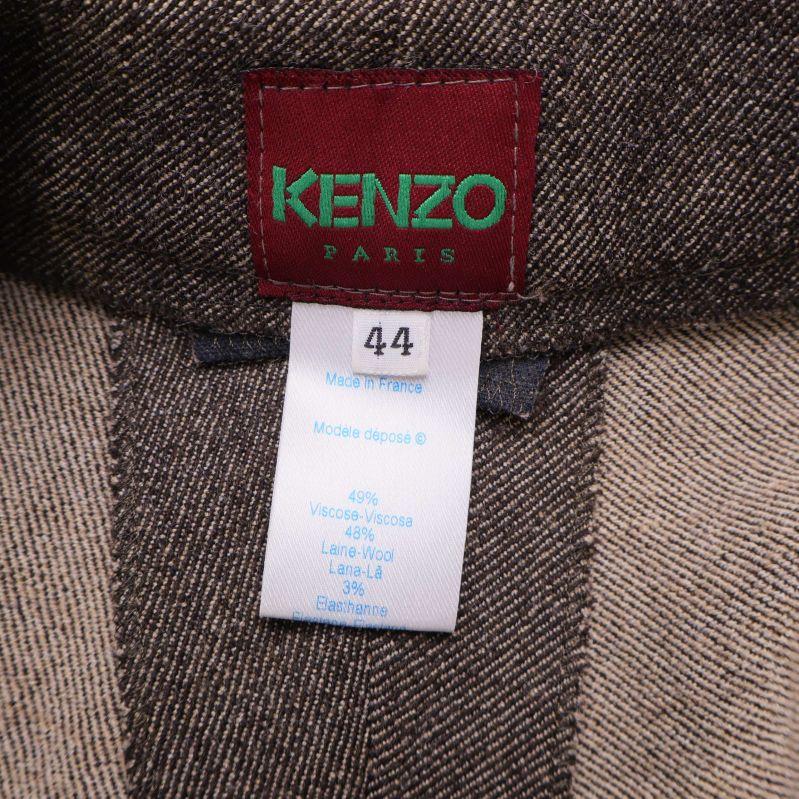 Närbild på Kenzo-etikett och materiallapp i midjan
