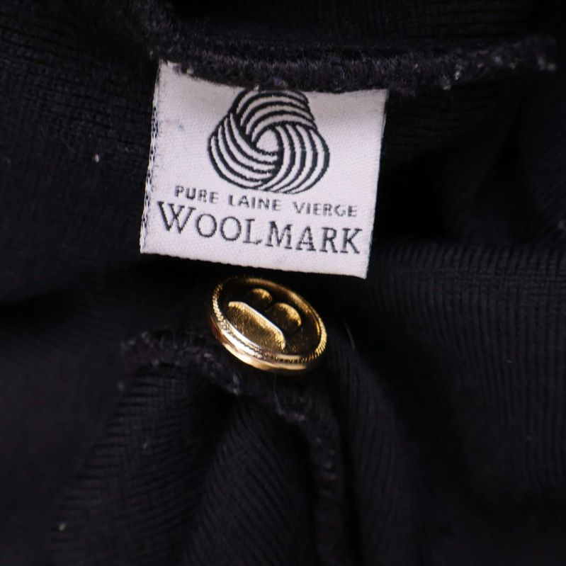 Woolmark-lapp som visar ren ny ull
