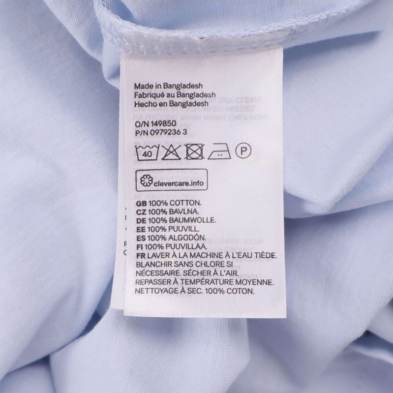 Materialetikett visar 100 procent bomull