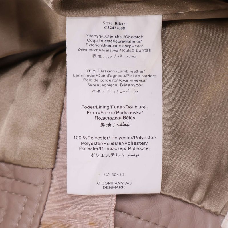 Materialetikett med detaljer om läder och polyesterfoder