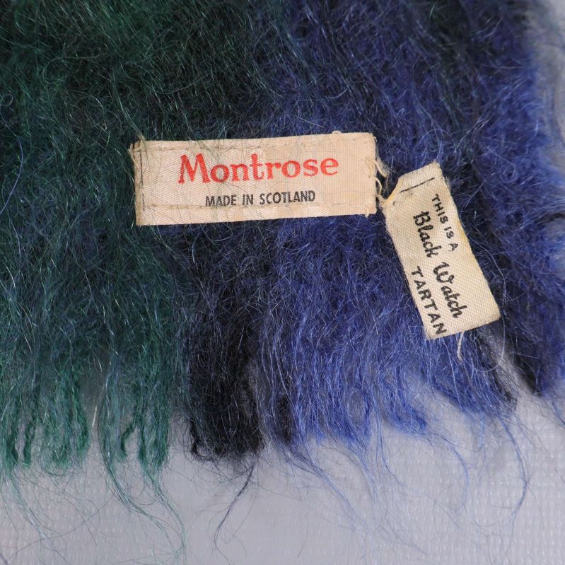 Etikett med texten Montrose och Black Watch tartan