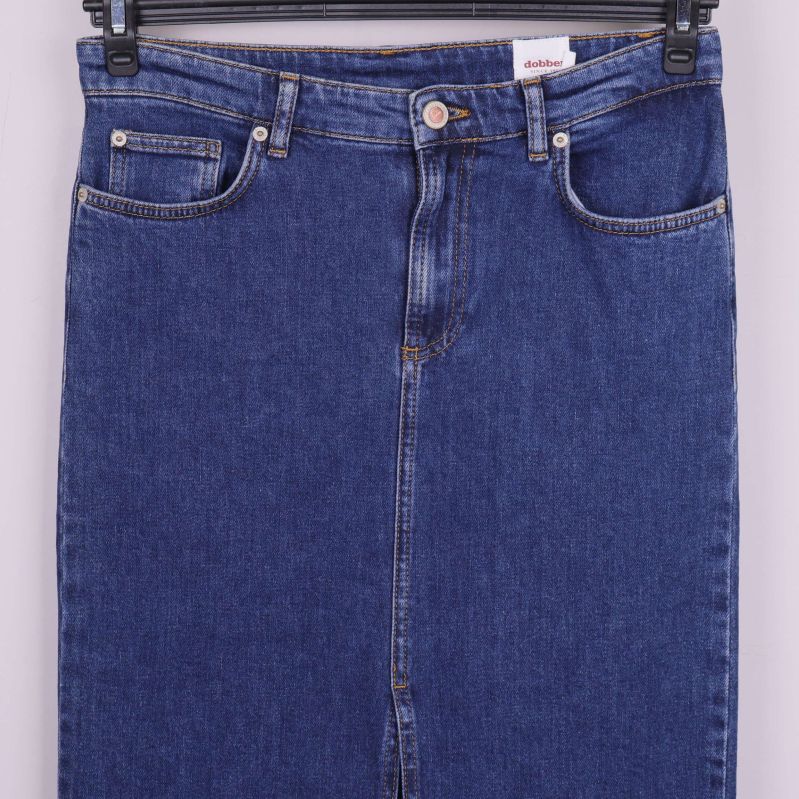 Övre del av denimkjol med synliga fickor och knapp