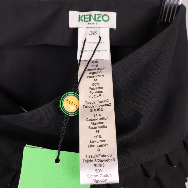 Materialetikett inuti kjol med Kenzo-logga och storlek 38