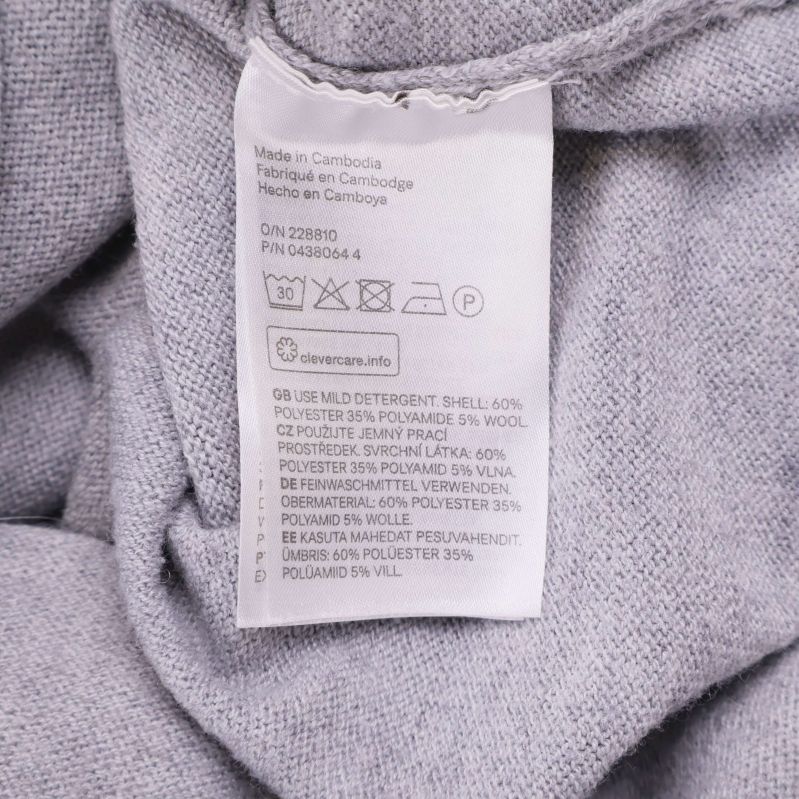 Materialetikett visar polyester, polyamid, ull