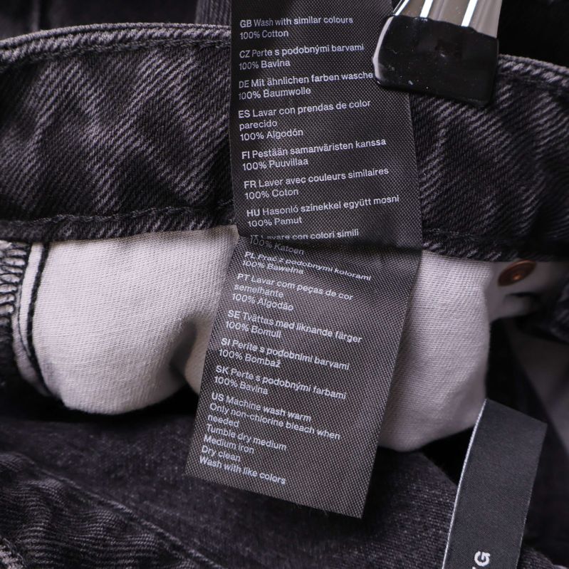 Materiallapp med text 100% bomull på flera språk