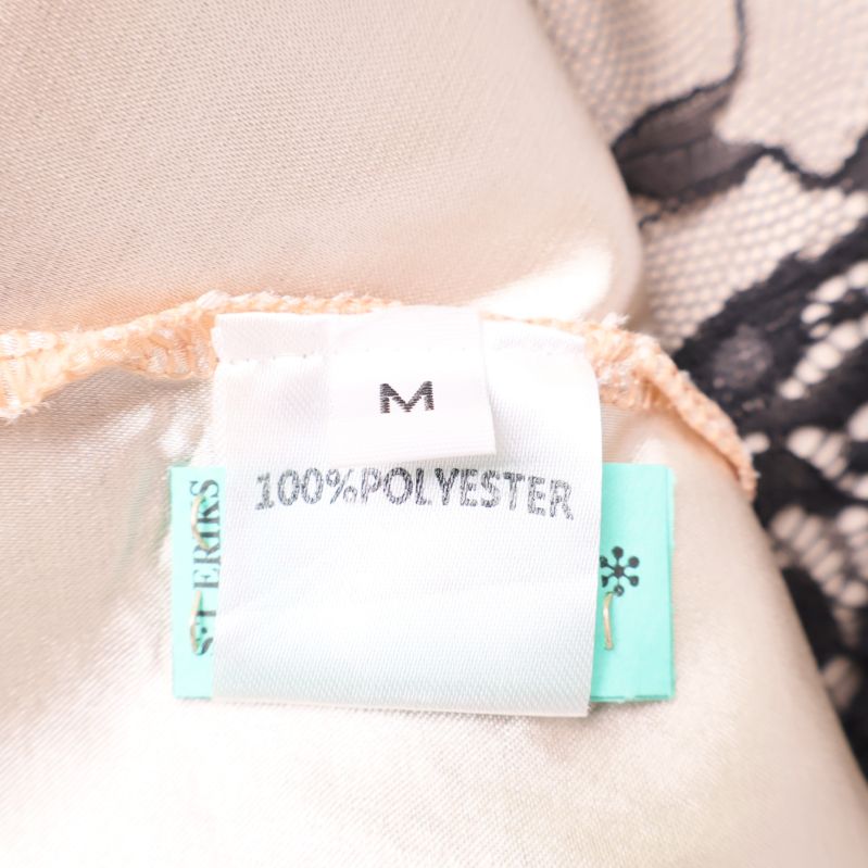 Materiallapp med text 100% polyester och storlek M