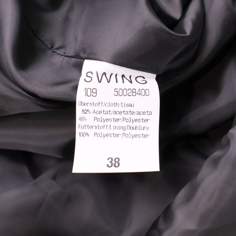 Materiallapp visar 52% acetat och 48% polyester