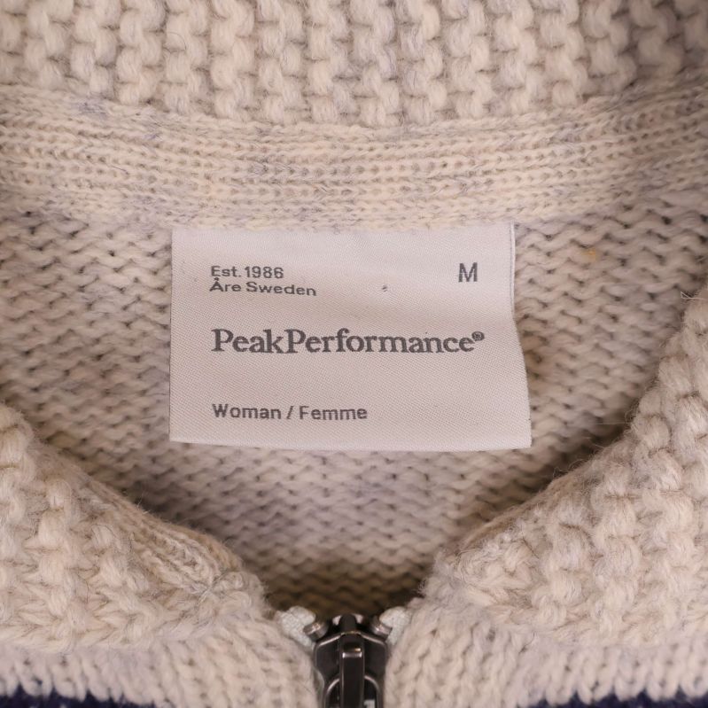 Nära på etikett Peak Performance woman och storlek M